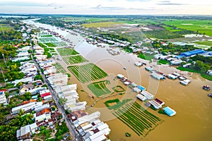 Floating village along Hau river over Vietnam border area, aerial view