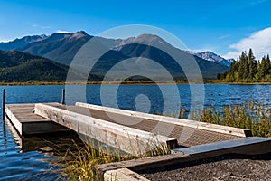 A floating, wooden dock into Vermillion Lake in Banff, Alberta, Canada