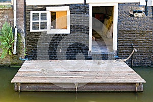 Floating wooden platform on canal in Alkmaar, Netherlands