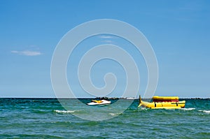 Floating  yellow  banana   boat ride  near seashoire  ready to be used for