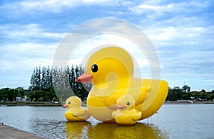 The floating yellow rubber ducks balloon float on the Nong Prachak lake
