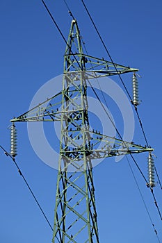 Flock of birds on high voltage pylon