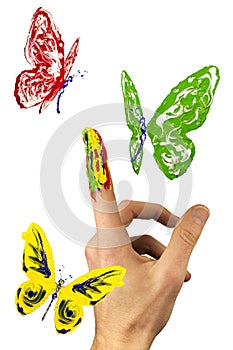 Flock of painted butterflies flying around finger