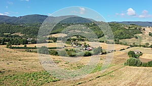 Flock of sheep grazes on a mountain slope. Aerial drone view