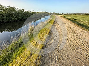 Flood barrier or dike, and a sandy hiking path.