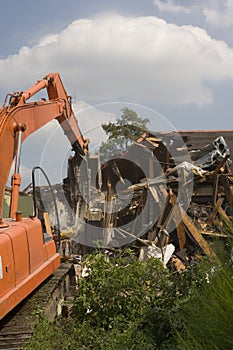 Flood Damaged home being torn down in New Orleans.