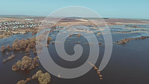 The flood of the river near the village. Flooding in the spring. Aerial view