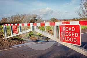 Flood Road Closed Warning Sign on Barrier