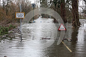 Flood sign in road