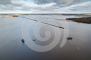 Flood in spring day. Flooded meadow and forest. Aerial view