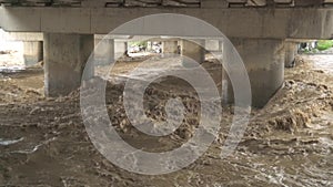 Flood waters between bridge columns