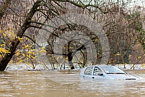 Flooded car during a stormy weather