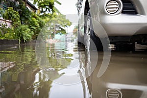 Flooded car vehicles after heavy rain,full of waste water on the road,street in the alley were covered with a large amount of