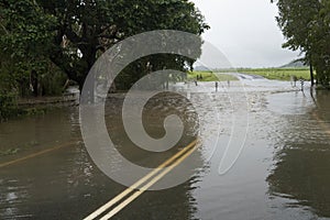 A flooded country road near Mackay, Queensland.