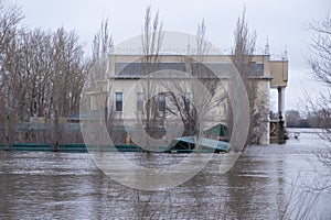 Flooded houses on the riverbank during the spring flood.