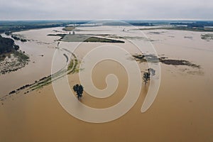 Flooded plain countryside landscape and river from drone pov photo
