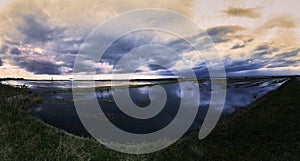 Flooded rice field for sowing with clouds.Albufera Valencia