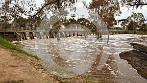 Flooded river over weir