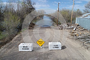 Flooded road with closed sign