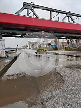 Flooded road under bridge