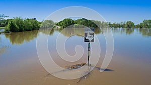 Flooded Roadway of Texas and a street Sign under water