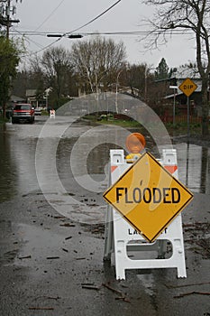 Flooded sign sits on a flooded street