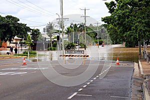 flooded street with a sign that says flood busters on the road photo