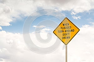 When flooded turn around. Road sign