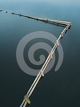 Flooded village, ruined old fence. Aerial view. photo