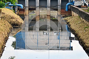 Floodgate aqueduct in a concrete wall for irrigation system and flood control