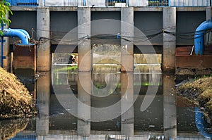 Floodgate aqueduct in a concrete wall for irrigation system and flood control low angle