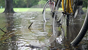 Flooding Cataclysm in Thailand. Bicycles Standing in Deep Water Puddle. Heavy Rain Season after Climate Changing in Asia