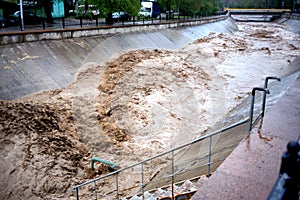 Flooding on mountain river in city