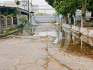 Flooding roadway as the clogged or ineffective street drainage system failed to release the water from the road