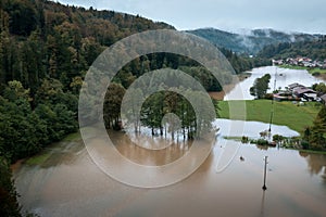 Flooding and submerging villages after extreme rainfall, aerial view