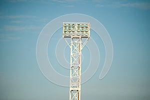 Floodlights over the field with clouds