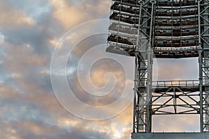 The floodlights at the stadium against the sky with clouds