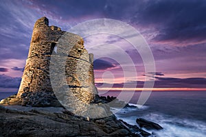 Floodlit Genoese tower at Erbalunga in Corsica at sunrise