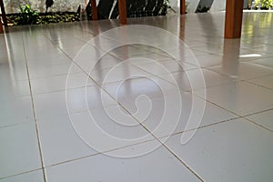 the floor of a building is made of clean white ceramic