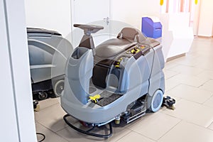 Floor care and cleaning services with professional washing machine on the charger machine inside public building