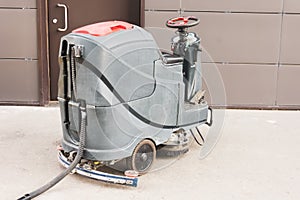 Floor care and cleaning services with professional washing machine the outside of the building drains dirty water