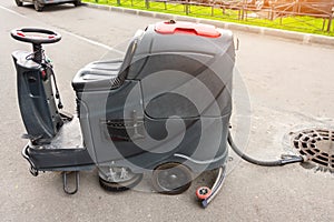 Floor care and cleaning services with professional washing machine the outside of the building drains dirty water