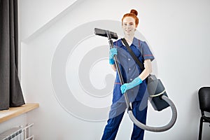 Floor care and cleaning services with vacuume cleaner at hotel room