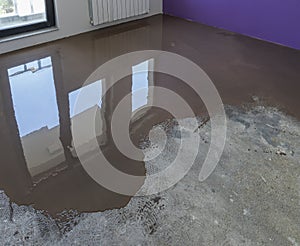 Floor covering with self leveling cement mortar. Mirror smooth s