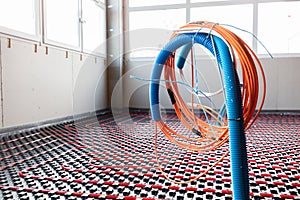 Floor heating and electrical outputs in a new building. Interior design photo