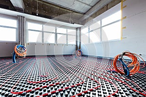 Floor heating and electrical outputs in a new building. Interior design photo