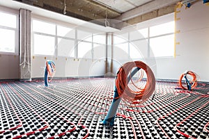 Floor heating and electrical outputs in a new building. Interior design photo