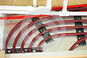 Floor heating pipe. Installation of engineering systems in a building.