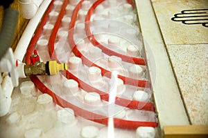 Floor heating pipe. Installation of engineering systems in a building.
