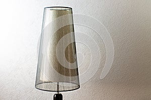 Floor lamp on wall background